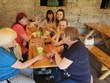 Společná fotografie u stolu. Zleva: p. Limberková, p. Parkosová, DiS., p. Neckářová, p. Iveta (dobrovolnice), ředitelka p. Mgr. Bělovová Dolejší, p. Šulerová